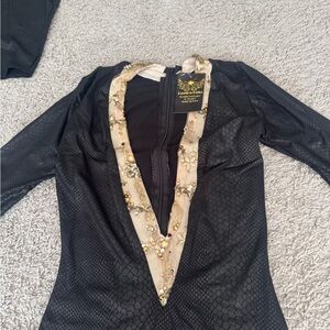 Deep v neck leather like black dress with gold trim and real Swarovski stones